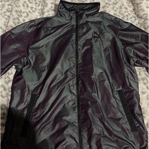 Woman’s Purple reflective windbreaker, Size small